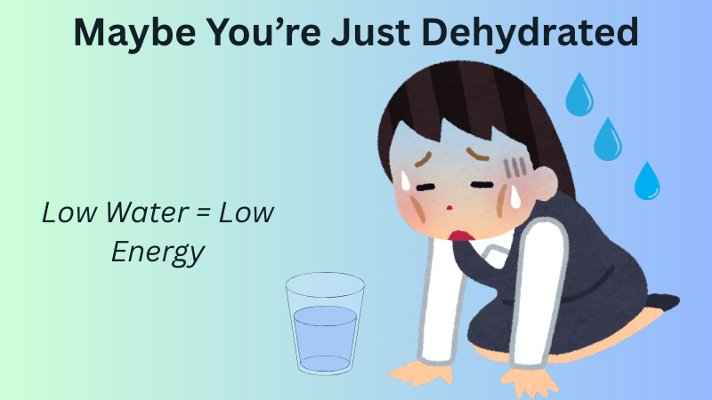 Tired woman sitting with glass of water showing dehydration and low energy